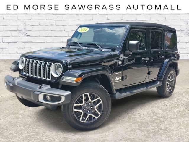 2024 Jeep Wrangler Sahara in Blk/Black — front three-quarter view