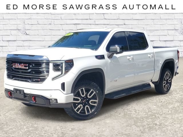 2024 GMC Sierra 1500 AT4 in Summit White — front three-quarter view